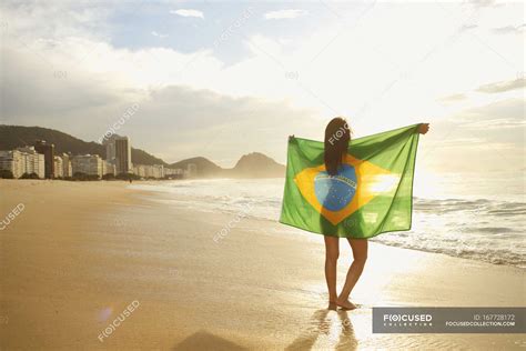Woman Holding Brazilian Flag On Copacabana Beach Rio Brazil Sand Brunette Stock Photo