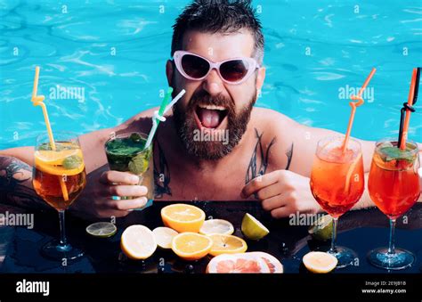 pool party man swimming and drink alcohol summer vacation at miami or maldives cocktail with