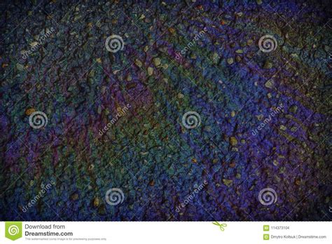 Multi Colored Oil Spill On Asphalt Road Abstract