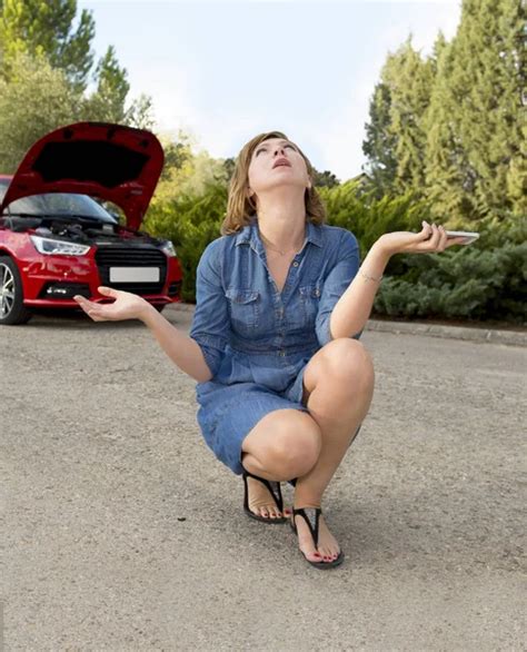 Attractive Desperate And Confused Woman Stranded On Roadside With