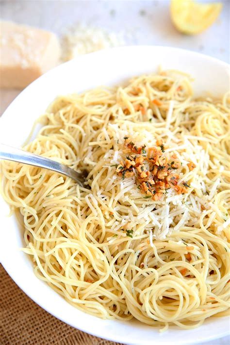 Heirloom or beefsteak, or a few. white bowl of angel hair pasta with toasted garlic and ...