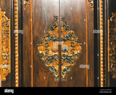 Stunning Typical Balinese Door With Wood And Golden Ornaments Stock