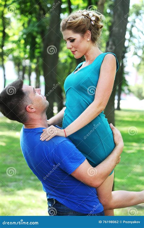 In Love Guy Holding Girl In His Arms Stock Photo Image Of Love