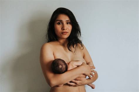 Premium Photo Naked Mother Holding Her Newborn Baby
