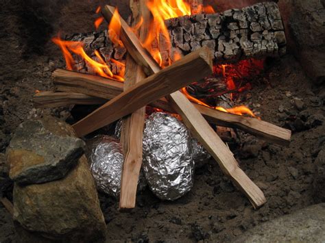 An alternate method, if you don't want to eat the skins, is to just put the sweet potato right down into the coals to bake. Giggling Gourmet's Campfire Baked Potatoes Recipe by Mike ...