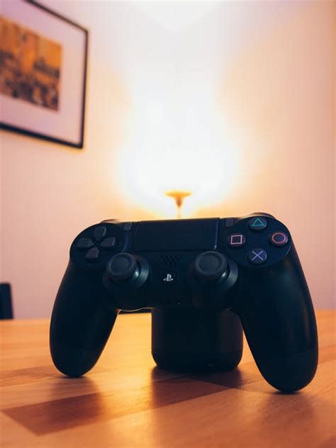 • how to set any image a screenshot from a usb ps4 game or any picture from the internet as a ps4 custom background themes tutorial usb ps4 5.50 system software update ps4 custom wallpaper ps4 cheap games: White Sony Ps4 Dualshock Placed on Table · Free Stock Photo