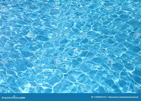 Crystal Clear Water Surface Of Swimming Pool Dazzling In The Summer