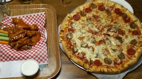 Sausage Pepperoni Pizza With A Side Of Wings From Mamas Pizza In