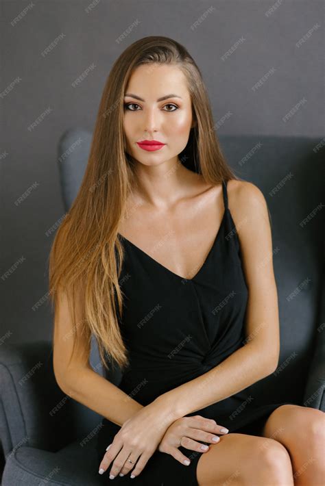 Premium Photo Beautiful Stylish Caucasian Girl With Long Hair And Professional Makeup With Red