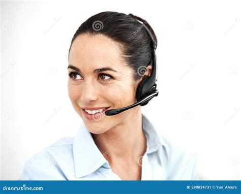 Ready To Help Attractive Female Customer Service Agent Using A Headset For Client Services