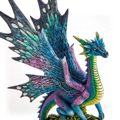 Metallic Rainbow Dragon On Leafy Stones Figurine