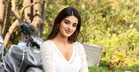 beauty galore hd nidhhi agerwal new photos in white dress sweet look at mr majnu movie promotion