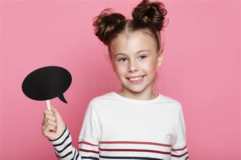 Cute Girl 7 8 Year Old Posing In Studio Over Pink Background Stock