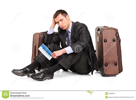 Sad Business Traveler Seated Next To A Suitcase Stock ...