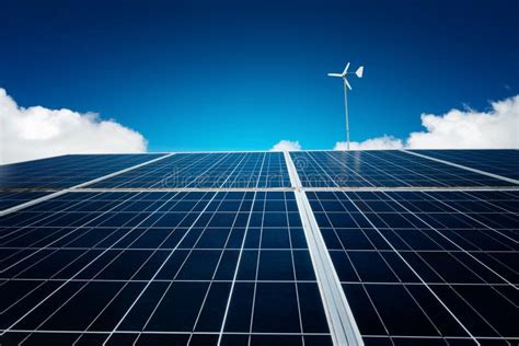 Blue Solar Panel With Wind Turbine On Blue Sky Stock Image Image Of