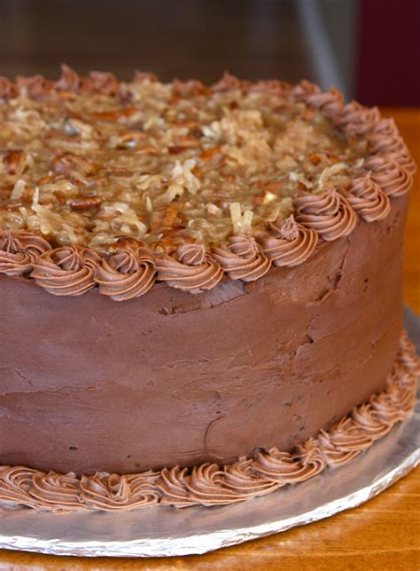 A traditional homemade german chocolate cake made from scratch with layers of moist and delicious chocolate cake and topped with lots of a rich coconut and pecan frosting! Homemade German Chocolate Cake