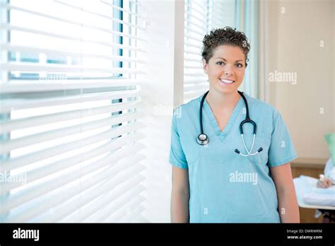 Confident Female Nurse With Stethoscope Around Neck Stock Photo Alamy