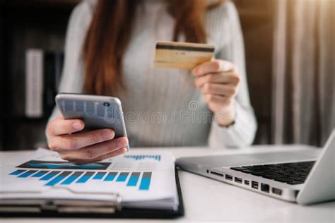 Women Holding Smartphones And Using Credit Cards And Laptop Computers