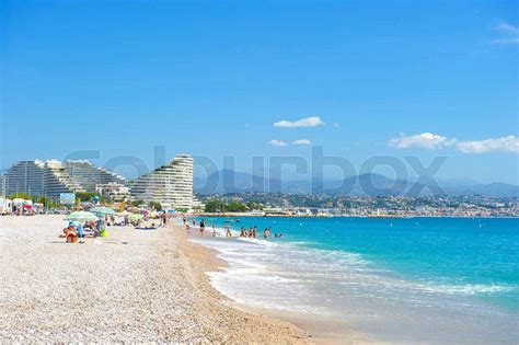 View Of The Beach In Nice France Cote Dazur Tourists Sunbeds And