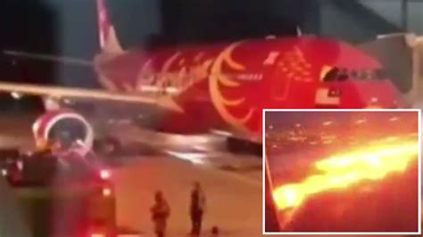 air asia flight makes emergency landing after passengers see sparks coming from engine triple m