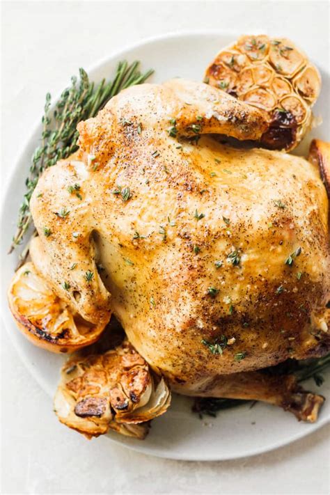 The chicken comes out perfectly tender, juicy + packed with flavor. Whole Roast Chicken (Lemon Garlic Roasted Chicken) (VIDEO!!)