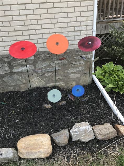 The most notable landmark of the akron ice house is the famous saw blade sculpture. Saw blade flowers | Garden sculpture, Outdoor decor, Flowers