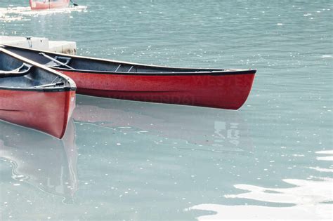 Canoe Moored In Lake Stock Photo