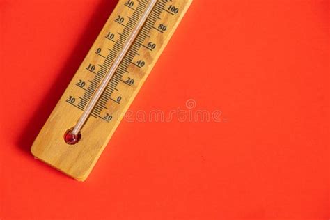 Wooden Thermometer Lies On A Red Background Closeup Stock Image Image