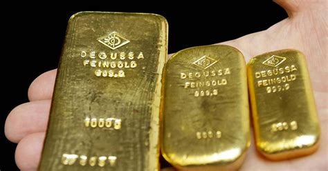 Gold Futures Settle Lower At 1382 Per Ounce