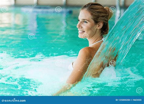 Portrait Of Beautiful Woman Relaxing In Swimming Pool Stock Photo