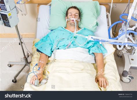 High Angle View Of Critical Patient With Endotracheal Tube Resting On