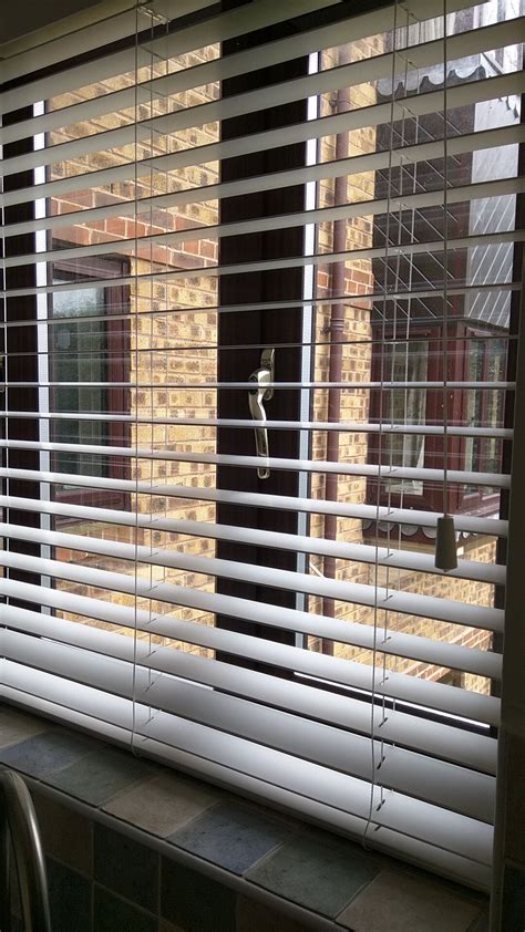 Maybe you would like to learn more about one of these? Wood venetian blind with strings in chalk white fitted to ...