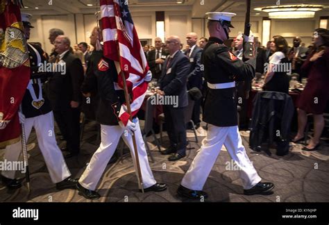 Members Of A Us Marine Corps Honor Guard Present Colors During The