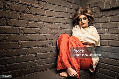 Crazy Woman Wearing A Straight Jacket In An Asylum Stock Photo
