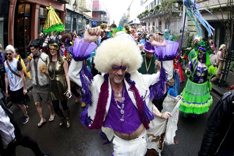 Revelers Parade Through The French Quarter On Mardi Gras Day In New Orleans