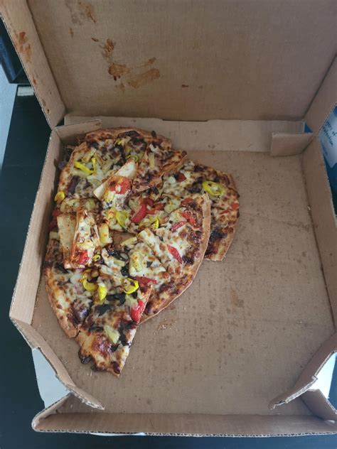 dominos is too overpriced and underwhelming to be delivering pizza