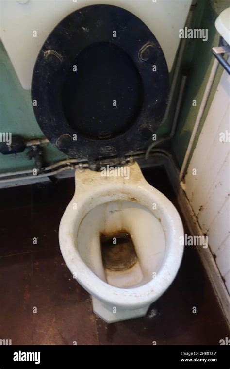 Filthy Dirty Toilet With Seat And Bowl In Public Bathrooms Not Been