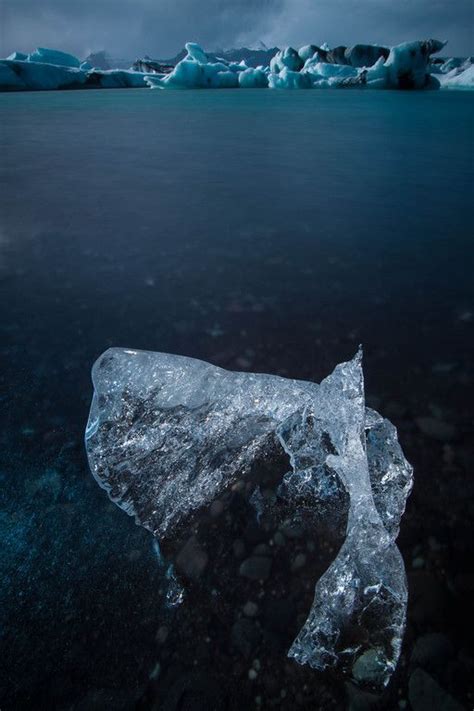 Icebergs On Volcanic Sand At The Stunning Jökulsárlón Glacier Lagoon