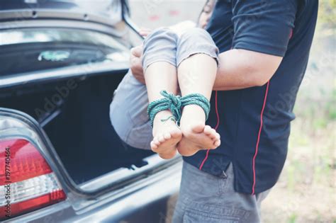 Man Kidnapped Babe Girl With Rope Tied Legs And Hands At The Trunk Stock Foto Adobe Stock