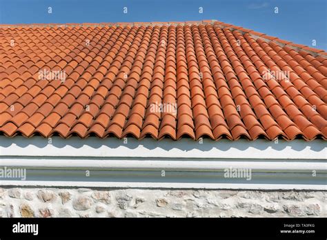 Red Corrugated Tile Element Of Roof Tile Pattern On House Over Blue And