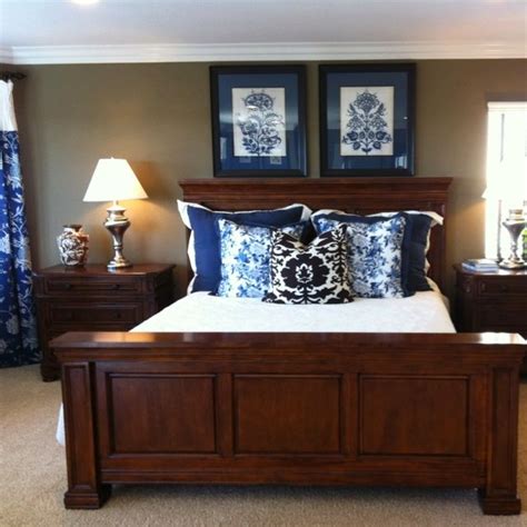Introduce contrast with white bedding and wood nightstands. Neutral paint, cherry furniture | Home ideas | Dark wood ...