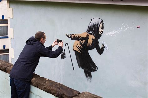 Street Art Depicting Sneezing Woman By Banksy Appears On Home