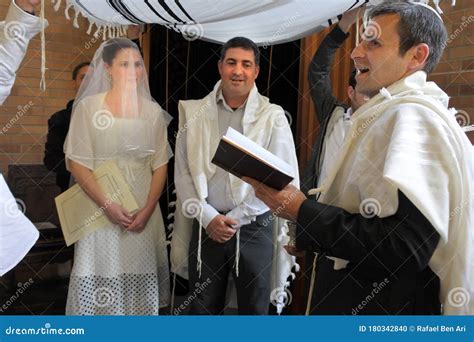 Rabbi Blessing Jewish Bride And A Bridegroom In Jewish Wedding Ceremony