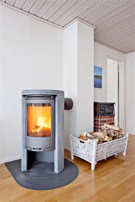 A sleek scandinavian morso wood stove replaced the previous unit, which had been situated so that its stovepipe blocked views from the kitchen and dining room. Grey Contura wood stove with soapstone. | Classic and ...