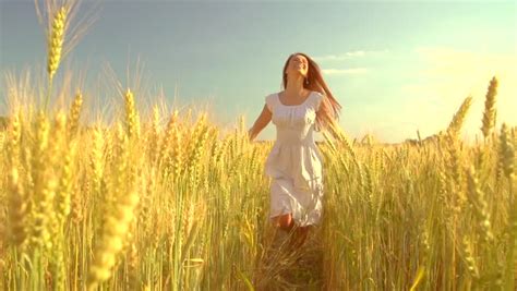 Beauty Girl Running On Yellow Wheat Field Over Sunset Sky Freedom Concept Happy Woman Outdoors