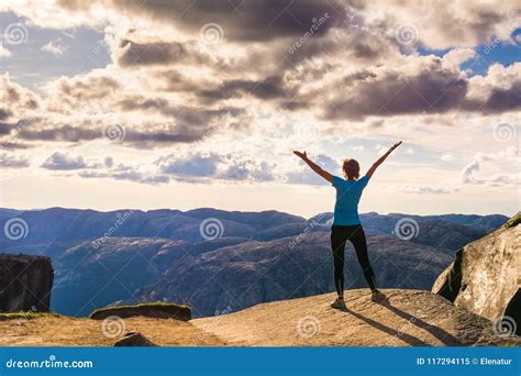 A Woman Is Standing On The Edge Of Cliff On The Way To Boulder Stock Image Image Of Girl