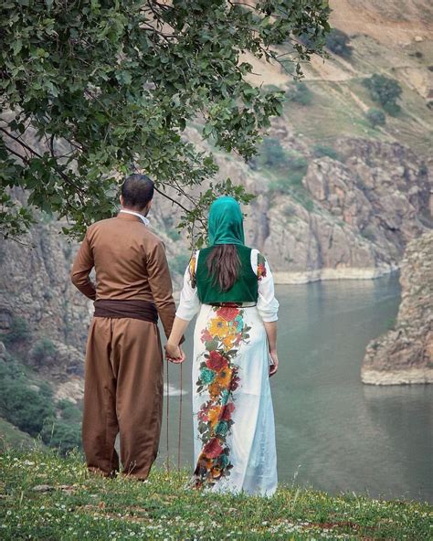 Kurdish Couple In Traditional Attire And A Magical View Over The Beautiful Landscape Of The