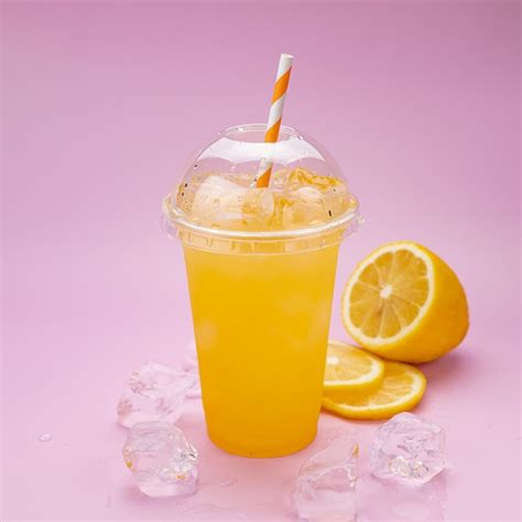 Premium Photo Fresh Lemonade With Oranges In A Plastic Cup