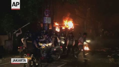 protesters clash with indonesian police after election loss