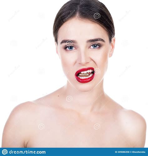 Beautiful Young Woman With Shell In Her Mouth Blue Eyed Girl With Red Lipstick Holding Bullet